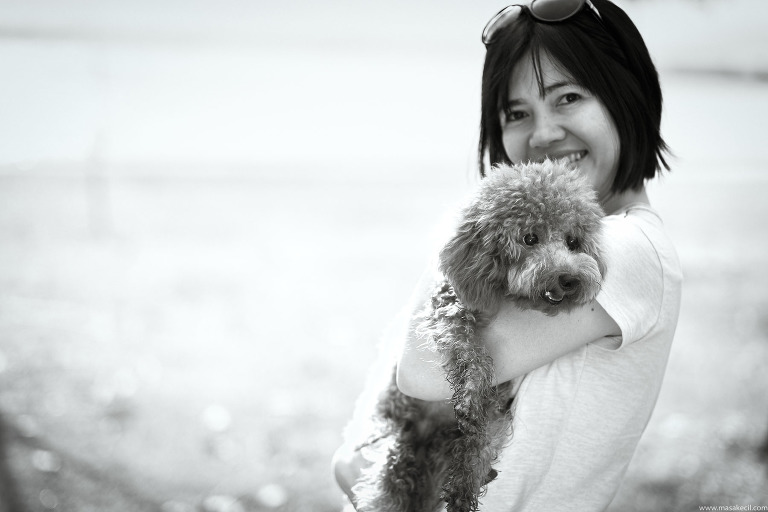 A poodle at the beach. Black and white dog photography.