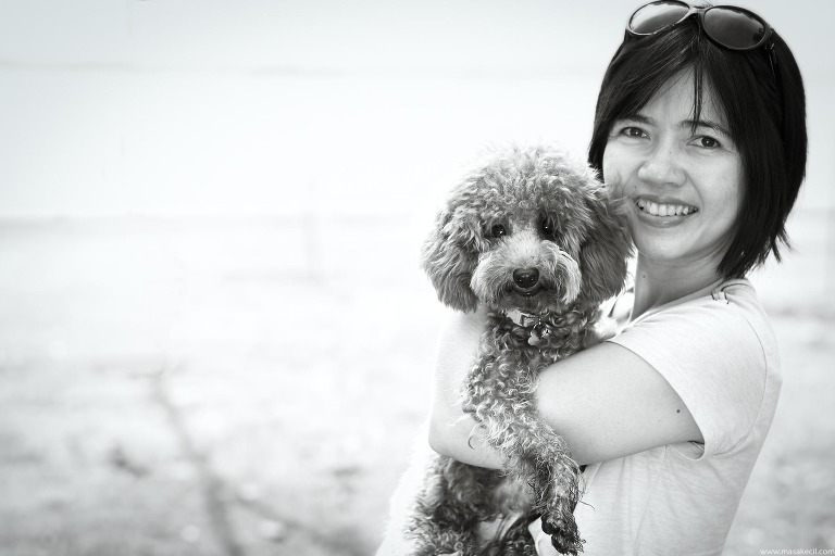 Black and white pet photography at the beach.